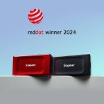 Kingston XS1000 1TB external solid state drive plugged into a modern sleek laptop transferring data over USB 3.2 Gen 2.
